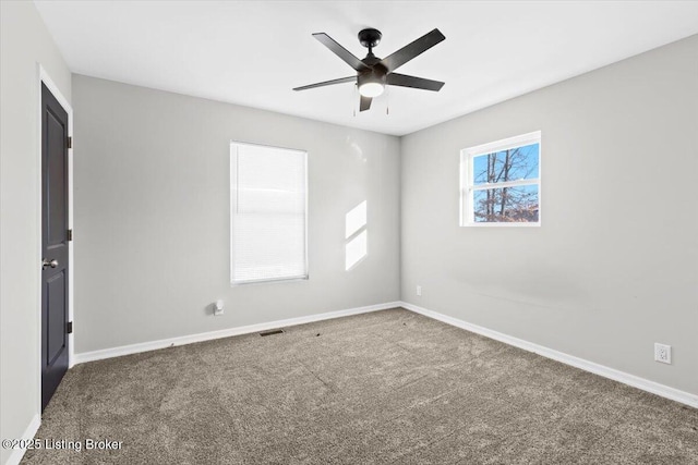 unfurnished room with carpet flooring and ceiling fan