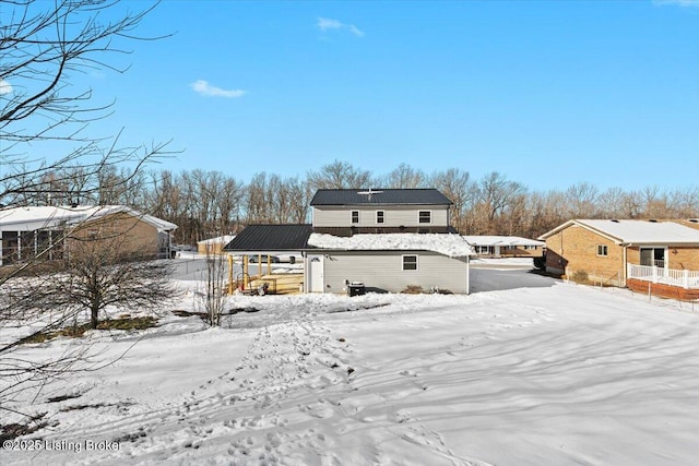 view of snow covered house