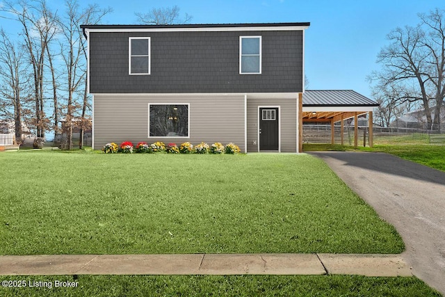 173 Kentucky Cir, Radcliff, KY 40160 - view of front of home with a carport, a front yard, and aphalt driveway