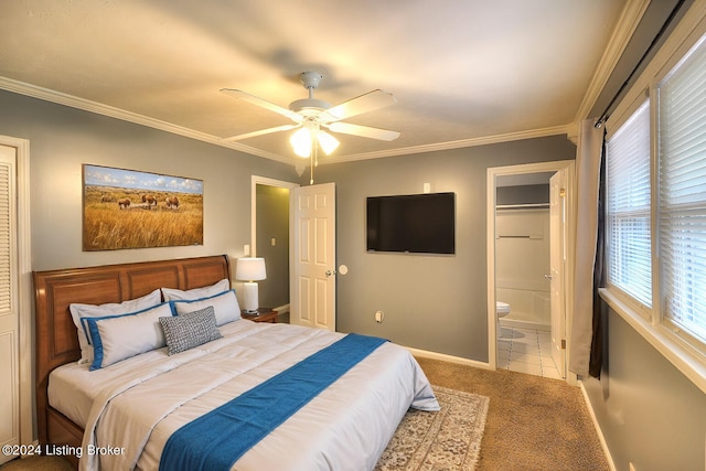 bedroom with carpet, connected bathroom, ceiling fan, and ornamental molding