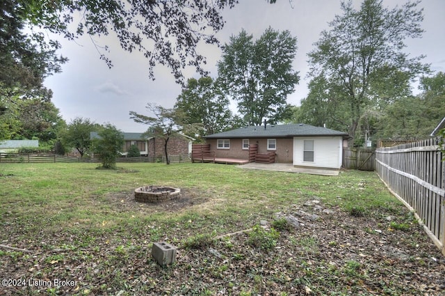 view of yard with a patio and a fire pit