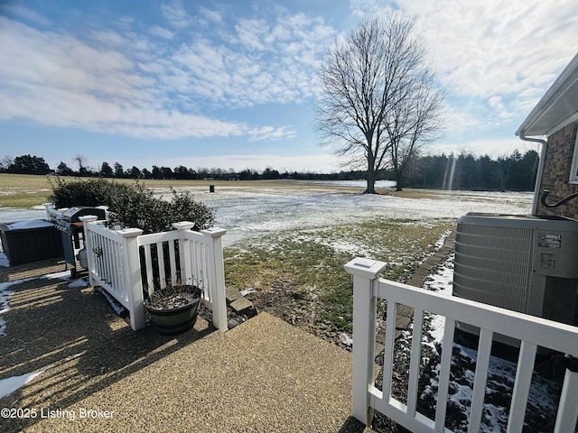 view of yard with a water view and central AC