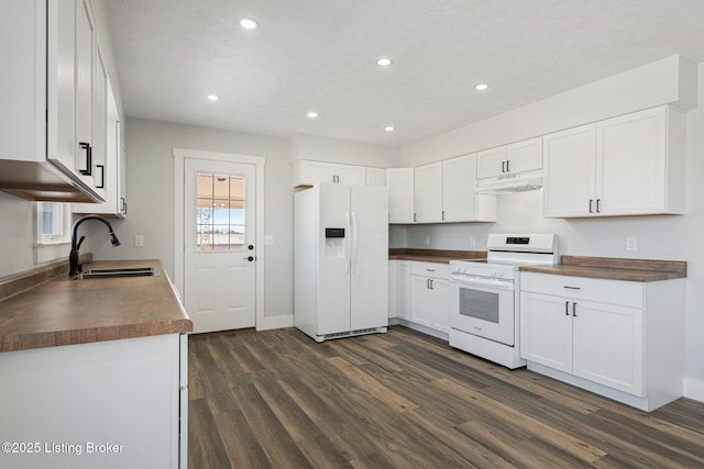 kitchen with sink, white cabinetry, white appliances, and dark hardwood / wood-style floors