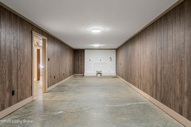 basement featuring wooden walls