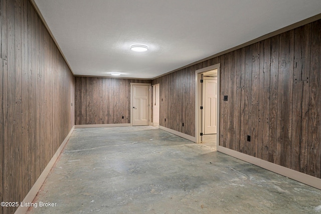 basement featuring wood walls