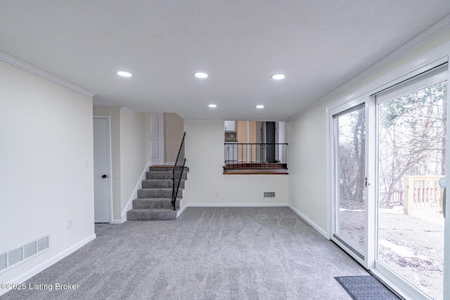 interior space featuring carpet flooring and crown molding