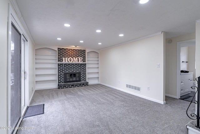 unfurnished living room with light carpet, built in shelves, ornamental molding, and a fireplace