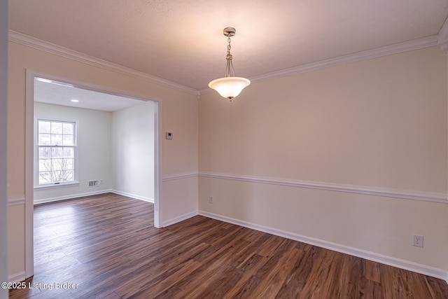 unfurnished room with ornamental molding and dark hardwood / wood-style floors