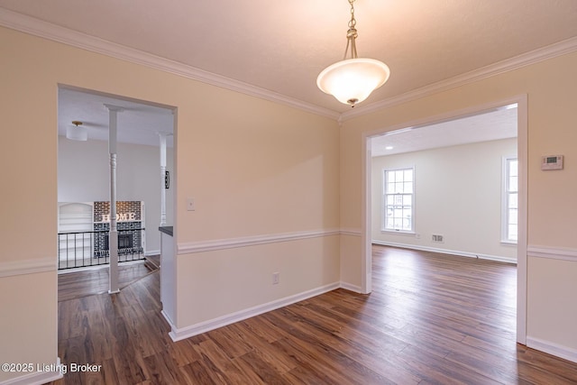 unfurnished room featuring crown molding and dark wood-type flooring