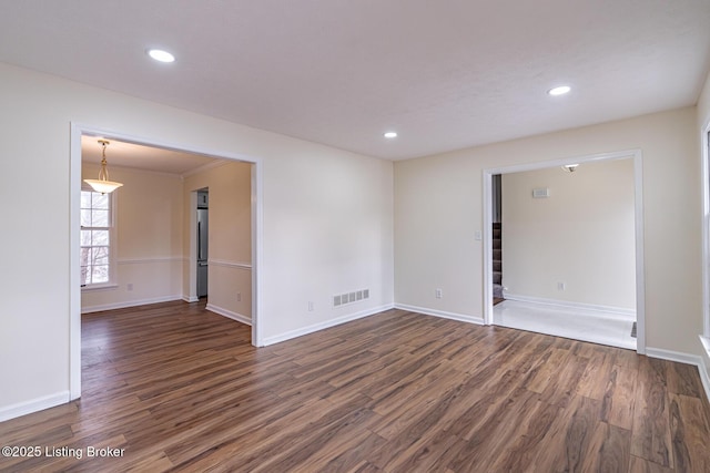 empty room featuring dark wood-type flooring