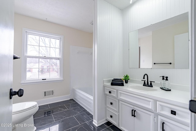 full bathroom featuring vanity, toilet, and shower / bathtub combination