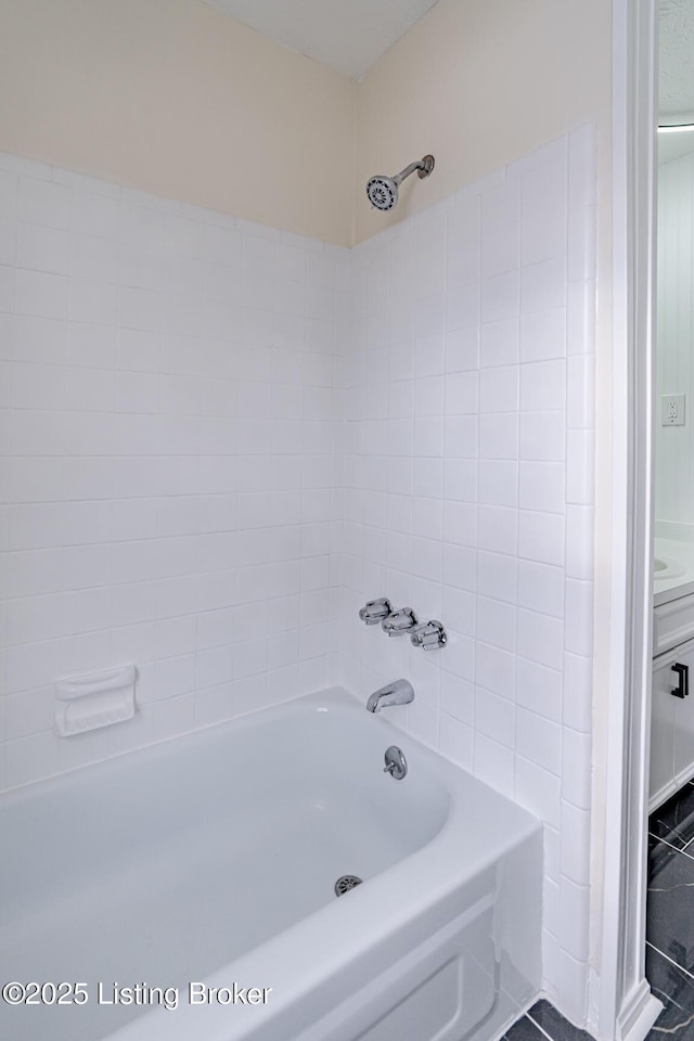 bathroom featuring tub / shower combination and tile patterned floors