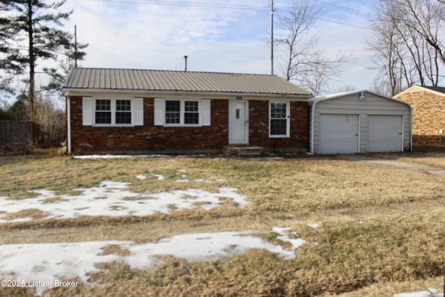 ranch-style house with a garage and an outbuilding