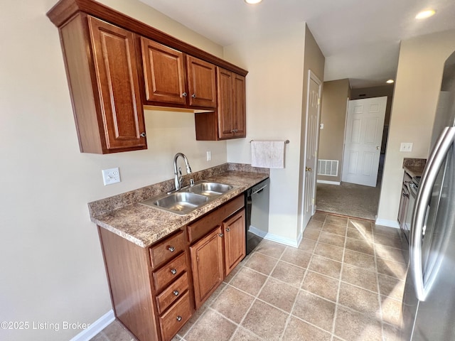 kitchen with sink, dishwasher, light colored carpet, and stainless steel fridge