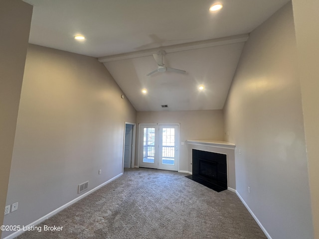 unfurnished living room with ceiling fan, carpet flooring, and lofted ceiling