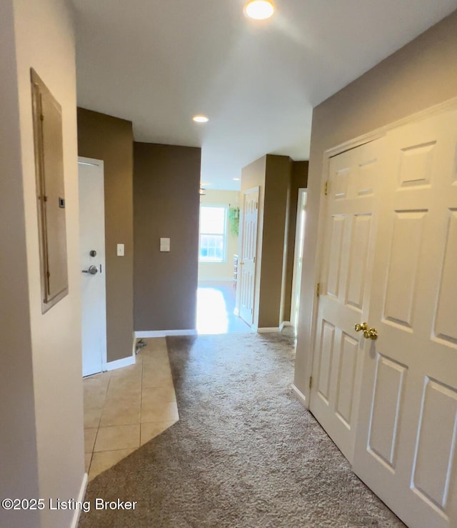 corridor featuring light tile patterned flooring