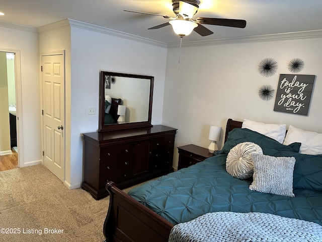 bedroom featuring ceiling fan, light colored carpet, and crown molding