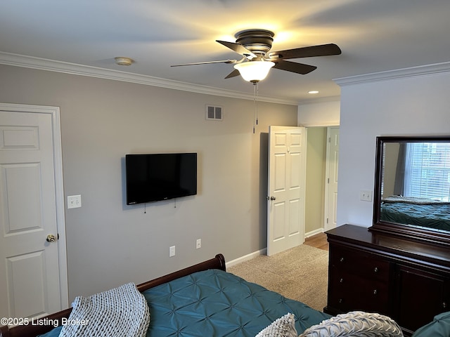 bedroom featuring ceiling fan, light colored carpet, and ornamental molding