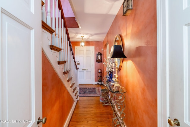 foyer entrance with hardwood / wood-style floors