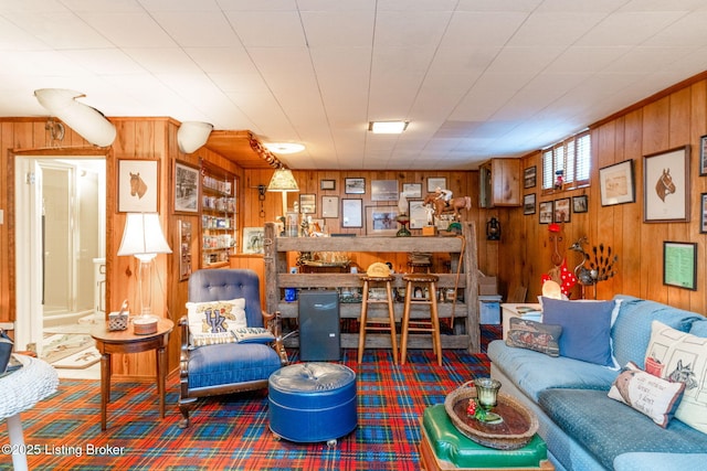 living room with wood walls