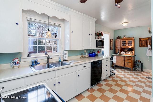 kitchen with white cabinetry, black dishwasher, sink, and pendant lighting