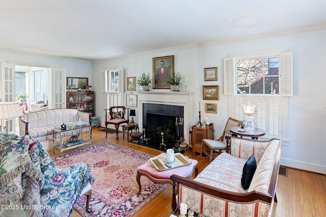 living room featuring ornamental molding and hardwood / wood-style floors