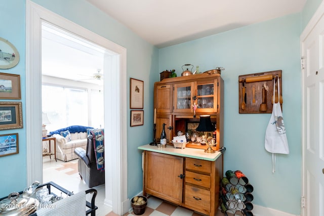 interior space featuring ceiling fan