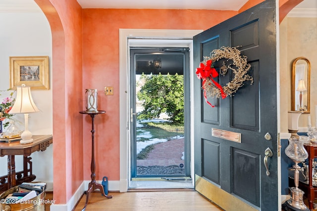 entryway with hardwood / wood-style flooring