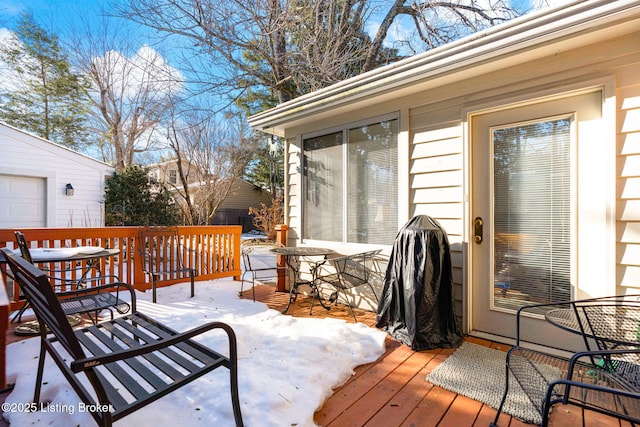 view of snow covered deck