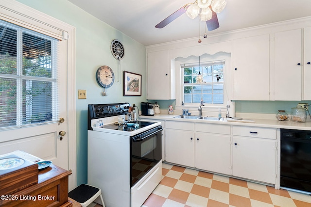 kitchen with electric range oven, dishwasher, sink, white cabinets, and ceiling fan