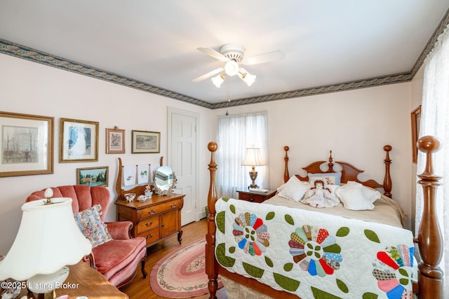 bedroom featuring ceiling fan and hardwood / wood-style floors