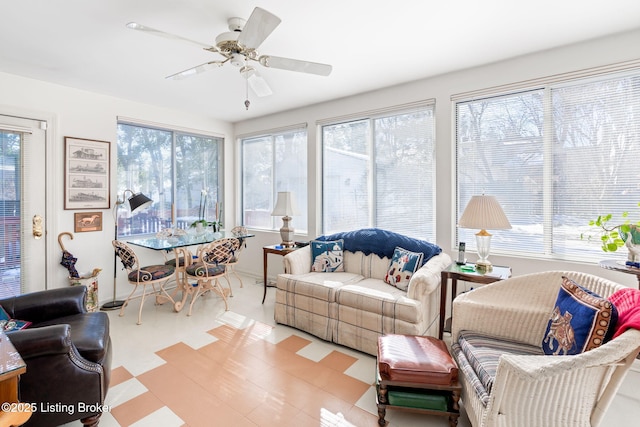 sunroom featuring ceiling fan