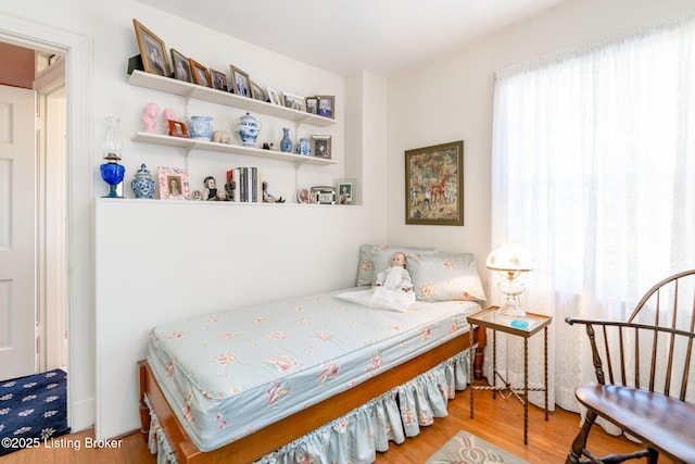 bedroom with hardwood / wood-style floors