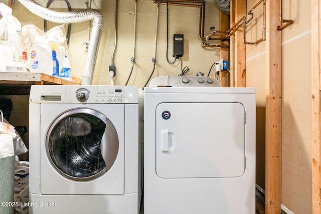 clothes washing area with independent washer and dryer