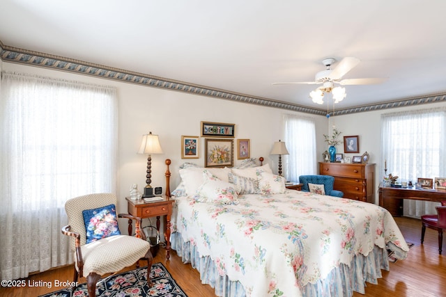 bedroom featuring wood-type flooring and ceiling fan