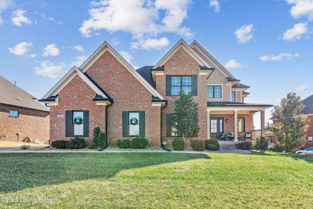 craftsman house featuring covered porch and a front lawn