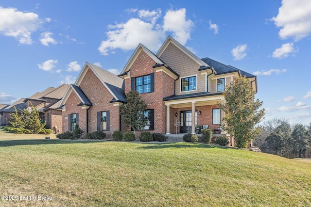 craftsman inspired home with a front yard and covered porch