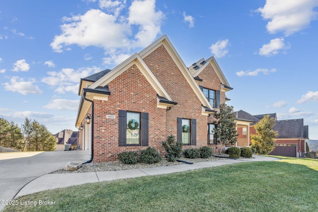 front facade with a garage and a front lawn