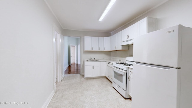 kitchen featuring white cabinetry, sink, white appliances, and ornamental molding