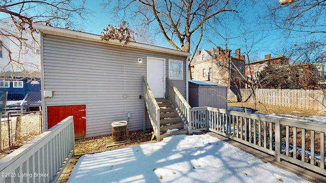 rear view of property featuring cooling unit