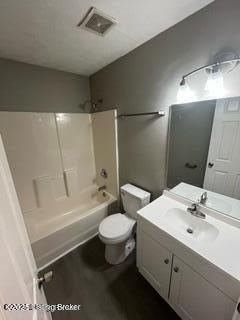 full bathroom with shower / bathing tub combination, vanity, and toilet