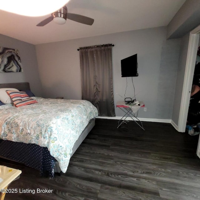 bedroom with ceiling fan and dark wood-type flooring