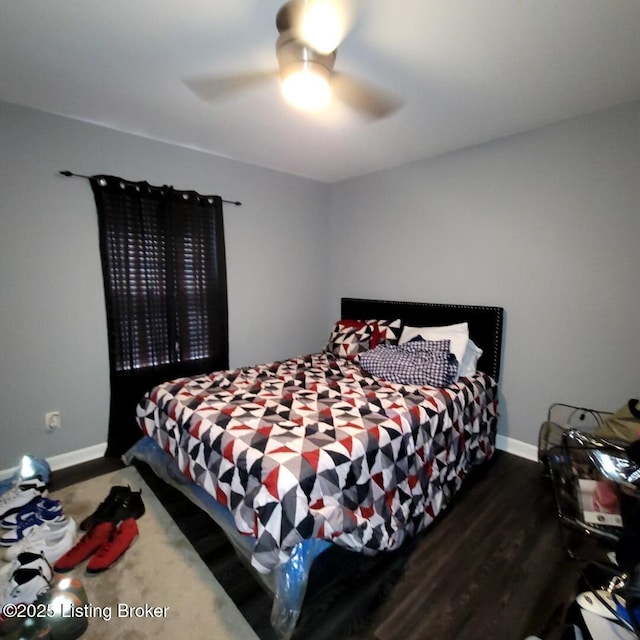 bedroom with ceiling fan and dark hardwood / wood-style floors