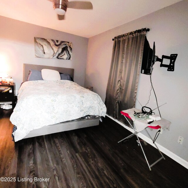 bedroom featuring hardwood / wood-style flooring and ceiling fan