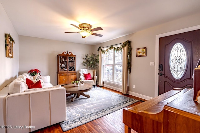 living room with wood-type flooring and ceiling fan