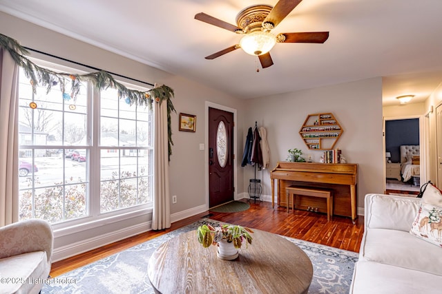 entrance foyer with dark hardwood / wood-style floors and ceiling fan