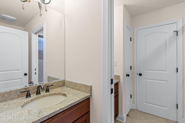 bathroom featuring tile patterned flooring and vanity