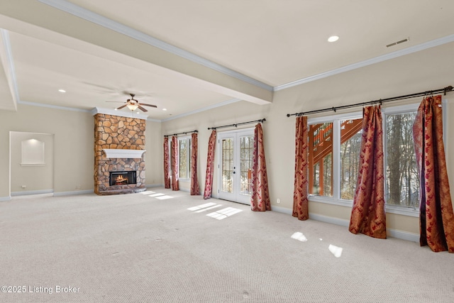 unfurnished living room with french doors, carpet, and crown molding