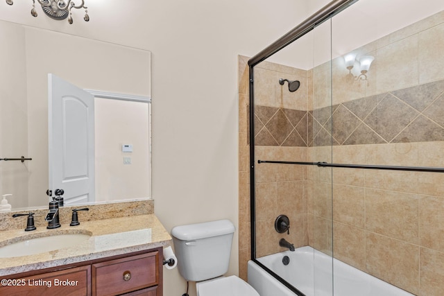 full bathroom featuring vanity, toilet, and enclosed tub / shower combo