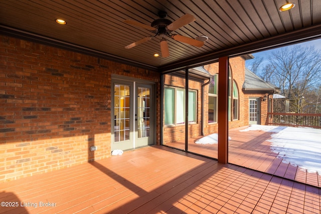 deck featuring ceiling fan and french doors